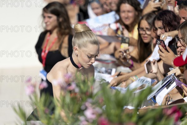Venice, Italy - 1 September 2025: Amanda Seyfried signing autographs during the Red Carpet of - The Testament of Ann Lee - during the 82nd Venice International Film Festival