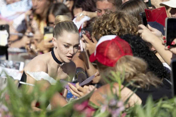 Venice, Italy - 1 September 2025: Amanda Seyfried signing autographs during the Red Carpet of - The Testament of Ann Lee - during the 82nd Venice International Film Festival