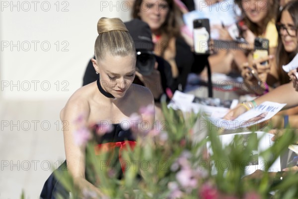 Venice, Italy - 1 September 2025: Amanda Seyfried signing autographs during the Red Carpet of - The Testament of Ann Lee - during the 82nd Venice International Film Festival