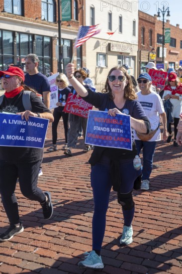 Detroit, Michigan USA - 1 September 2025 - Members of Indivisible march in Detroit's Labor Day parade