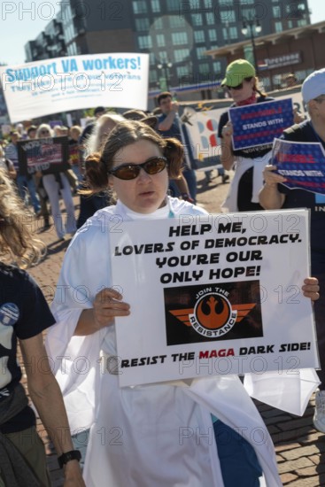 Detroit, Michigan USA - 1 September 2025 - A union member dressed as Princess Leia from Star Wars marches in Detroit's Labor Day parade, warning of 'the MAGA dark side.'