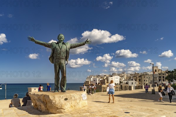 Statue of the singer Domenico Modugno, Polignano a Mare, Apulia, Italy