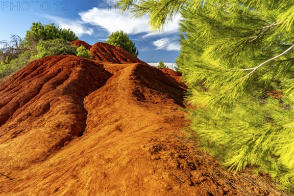 Red rocks in the landscape at Cava di Bauxite, Otranto, Apulia, Italy