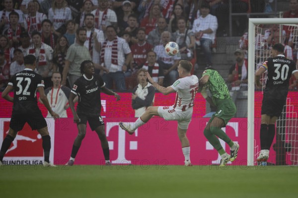 (DFL/DFB REGULATES PROHIBIT ANY USE OF PHOTOGRAPHS AS IMAGE SEQUENCES AND/OR QUASI-VIDEO), RheinEnergieStadion, Cologne, North Rhine-Westphalia, Isak Joannesson (1.FC Köln, midfield, #18), Alexander Schwolow (SC Freiburg, goalkeeper, #1), 1st Bundesliga, 1.FC Köln, SC Freiburg on 31.08.2025 at the RheinEnergieStadion in Cologne Germany
