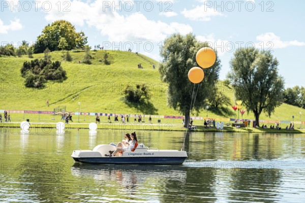 Festival visitors ride a pedal boat at the Superbloom Festival, Day 2 in the Olympic Park, Munich, 31-08.2025