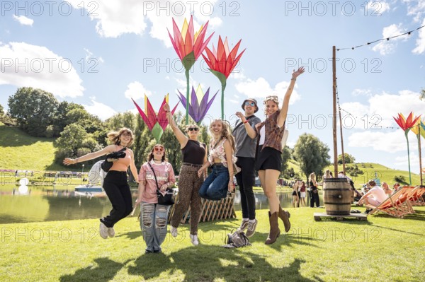 Festival-goers jump into the air at the Superbloom Festival, day 2 in the Olympic Park, Munich, 31-08.2025