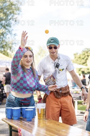 Festival visitors play beer pong at the Superbloom Festival Beerpong, Day 2 in the Olympic Park, Munich, 31-08.2025