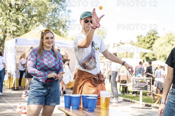 Festival visitors play beer pong at the Superbloom Festival Beerpong, Day 2 in the Olympic Park, Munich, 31-08.2025