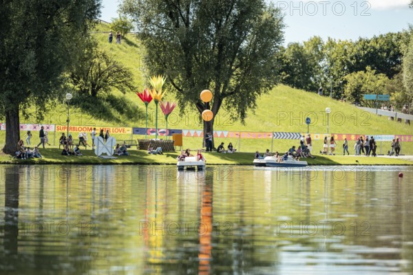 Festival visitors ride a pedal boat at the Superbloom Festival, Day 2 in the Olympic Park, Munich, 31-08.2025