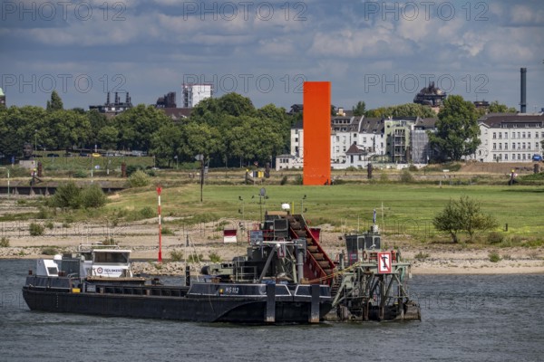 Bucket chain dredger at work on the Rhine near Duisburg, between the Neuenkamper Rhine Bridge and the Friedrich-Ebert Bridge in Ruhrpott, dredging the navigation channel, North Rhine-Westphalia, Germany