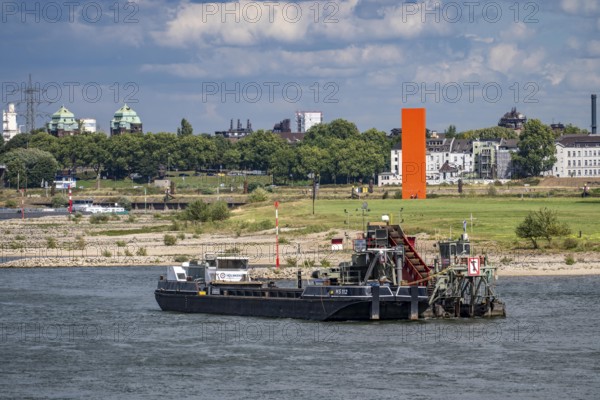Bucket chain dredger at work on the Rhine near Duisburg, between the Neuenkamper Rhine Bridge and the Friedrich-Ebert Bridge in Ruhrpott, dredging the navigation channel, North Rhine-Westphalia, Germany