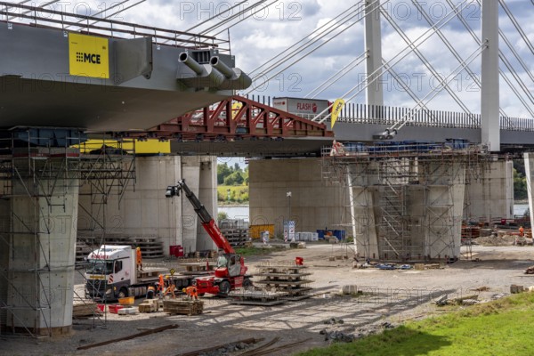 New construction of the second motorway bridge Neuenkamp of the A40, over the Rhine near Duisburg, parallel to the already existing first bridge, most of the new bridge piers are in place, two first bridge segments are finished and have already been moved towards the river on both sides of the Rhine, full completion is planned for 2028, North Rhine-Westphalia, Germany