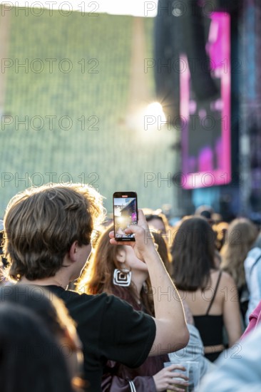 Visitor films the performance of Nelly Furtado at the Superbloom Festival, Day 1 at the Olympiapark, Munich, 30/08/2025