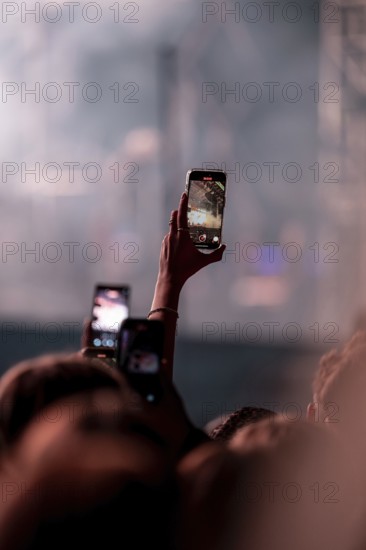Visitors film Post Malone's performance at the Superbloom Festival, Day 1 at the Olympiapark, Munich, 30/08/2025
