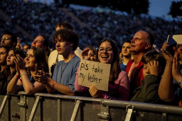 Visitor shows sign at the performance of Raye at the Superbloom Festival, Day 1 at the Olympiapark, Munich, 30/08/2025