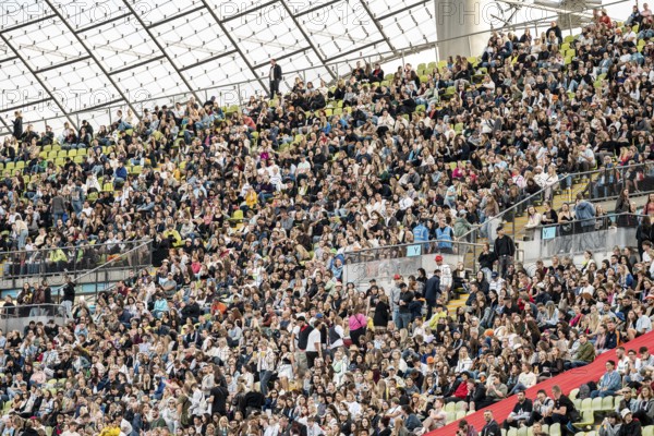 Festival visitors sitting in the stands in the Olympic Stadium at the Superbloom Festival, Day 1 in the Olympic Park, Munich, 30/08/2025