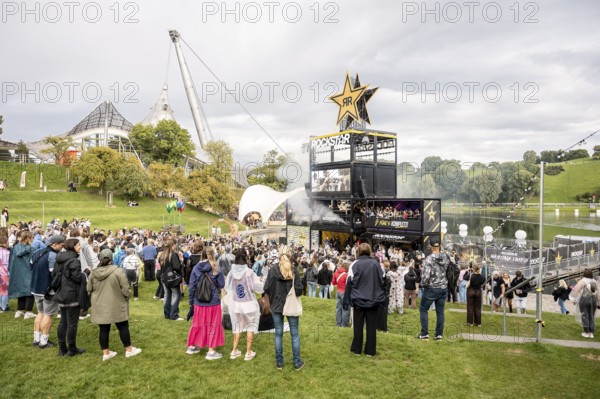 Festival visitors celebrate on the Rockstar Energy Tower at the Superbloom Festival, Day 1 in the Olympic Park, Munich, 30/08/2025