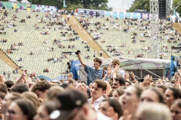 Festival visitors celebrate the performance of Roy Bianco & The Abbrunzati Boys at the Superbloom Festival, Day 1 at the Olympiapark, Munich, 30/08/2025