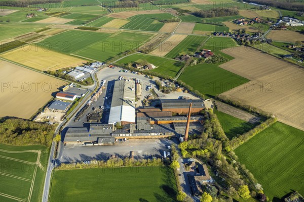 Aerial view, Raiffeisen Vital eG and Hüning Elementbau with chimney, Olfen-Kirchspiel, Olfen, Münsterland, North Rhine-Westphalia, Germany, DE, Europe, commercial enterprises, commercial area, commercial property, commercial site, commercial use, industrial area, industrial site, aerial photograph, aerial photography, aerial photography, overview, bird's eye view, birds-eyes view, overview