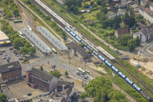 Aerial view, Sterkrade railway station with goods train, ZOB bus station and station forecourt, Schwarze Heide, Oberhausen, Ruhr area, North Rhine-Westphalia, Germany, railway area, railway station, station forecourt, platform, DE, Deutsche Bahn AG, Europe, track systems, tracks, main station, main station, aerial view, aerial photography, aerial photography, overview, bird's-eye view, overview, OberhausenNord