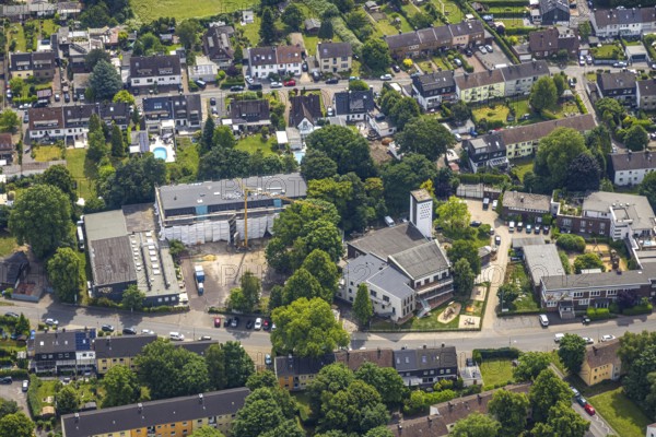 Aerial view, construction site with renovation primary school at Froschenteich, Heilig-Geist-Kirche, Oberhausen, Ruhr area, North Rhine-Westphalia, Germany, place of worship, construction work, construction area, building site, building plots, construction project, construction site, education, DE, Europe, religious community, place of worship, primary school, holy site, church, parish, denomination, educational institute, aerial view, aerial photography, aerial photography, new building, religion, religious site, renovation, refurbishment, school, overview, bird's-eye view, overview, OberhausenSued