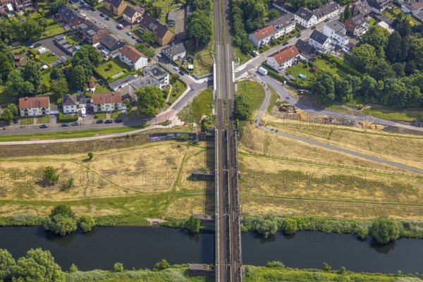 Aerial view, Ruhr river and Ruhr valley with railway bridge, construction site Am Ruhrufer and Fährstraße, near the Ruhrpark, Oberhausen, Ruhr area, North Rhine-Westphalia, Germany, construction work, construction area, construction site, building plots, construction project, construction site, DE, Europe, aerial view, aerial photography, aerial photography, new building, overview, bird's eye view, birds-eyes view, overview, OberhausenSued