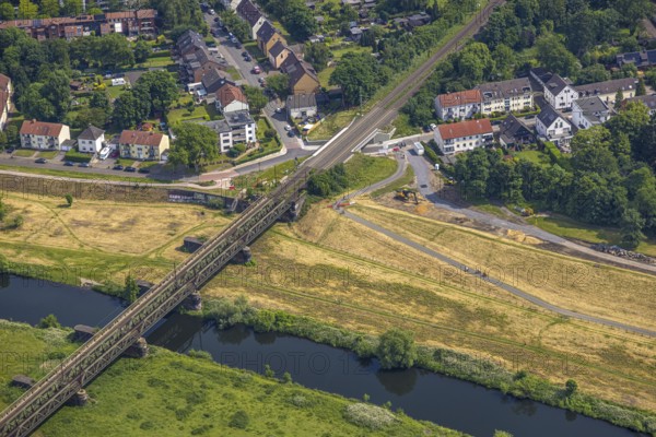 Aerial view, Ruhr river and Ruhr valley with railway bridge, construction site Am Ruhrufer and Fährstraße, near the Ruhrpark, Oberhausen, Ruhr area, North Rhine-Westphalia, Germany, construction work, construction area, construction site, building plots, construction project, construction site, DE, Europe, aerial view, aerial photography, aerial photography, new building, overview, bird's eye view, birds-eyes view, overview, OberhausenSued