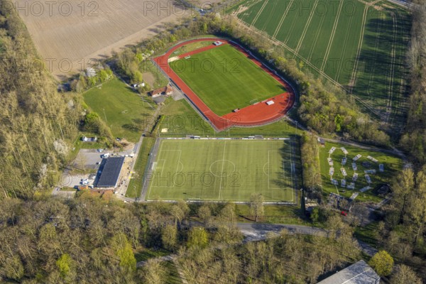 Aerial view, sports field football stadium and athletics stadium FC Nordkirchen 1926 e.V., building construction site, miniature golf course, Nordkirchen, Münsterland, North Rhine-Westphalia, Germany, construction work, construction area, building site, building plots, construction project, construction site, DE, Europe, football field, football stadium, aerial view, aerial photography, aerial photography, sports, sports facilities, sports field, sports facility, stadium, overview, bird's eye view, birds-eyes view, overview