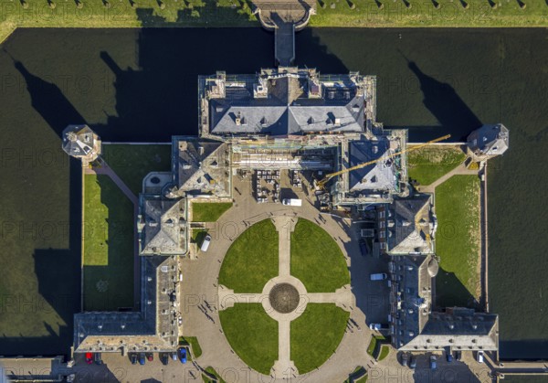 Aerial view, Nordkirchen Castle, baroque castle complex, moated castle, castle garden shapes and colours, construction site with scaffolding on the facade, vertical shot, Nordkirchen, Münsterland, North Rhine-Westphalia, Germany, baroque residence, construction work, construction area, building site, building plots, construction project, construction site, DE, monument protection, Europe, aerial view, aerial photography, aerial photography, castle, overview, Venus Island, Versailles style, bird's eye view, moated castle, birds-eyes view, overview