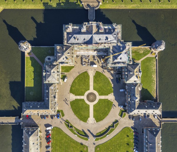 Aerial view, Nordkirchen Castle, baroque castle complex, moated castle, castle garden shapes and colours, construction site with scaffolding on the facade, vertical shot, Nordkirchen, Münsterland, North Rhine-Westphalia, Germany, baroque residence, construction work, construction area, building site, building plots, construction project, construction site, DE, monument protection, Europe, aerial view, aerial photography, aerial photography, castle, overview, Venus Island, Versailles style, bird's eye view, moated castle, birds-eyes view, overview
