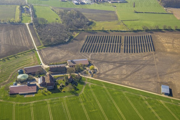 Aerial photo, solar park, open space photovoltaic plant in the Berger farming community, Baustoffkontor Nord GmbH solar technology provider, Nordkirchen, Münsterland, North Rhine-Westphalia, Germany, DE, Europe, photovoltaics, aerial photo, aerial photography, aerial photography, photovoltaic plant, solar, solar plant, solar energy, solar panel, solar power plant, overview, bird's eye view, birds-eyes view, overview