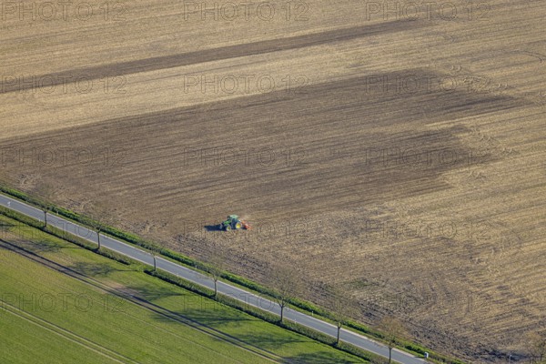 Aerial view, agricultural work with tractor on a field, Ascheberger Straße with tree avenue, Capelle, Nordkirchen, Münsterland, North Rhine-Westphalia, Germany, agricultural landscape, DE, Europe, agricultural machinery, agriculture, agricultural fields, aerial view, aerial photography, aerial photography, overview, bird's-eye view, overview
