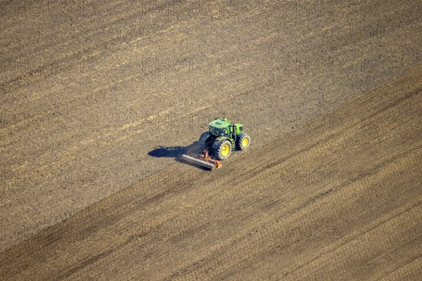 Aerial view, agricultural work with tractor on a field on Ascheberger Straße, Capelle, Nordkirchen, Münsterland, North Rhine-Westphalia, Germany, agricultural landscape, DE, Europe, agricultural machinery, agriculture, agricultural fields, aerial view, aerial photography, aerial photography, overview, bird's-eye view, bird's-eye view, overview