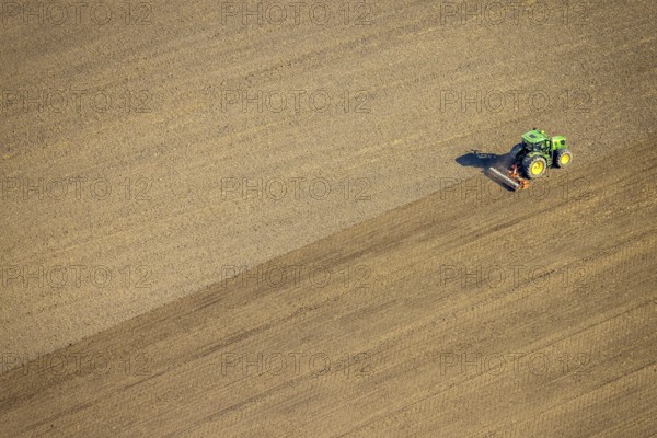 Aerial view, agricultural work with tractor on a field on Ascheberger Straße, Capelle, Nordkirchen, Münsterland, North Rhine-Westphalia, Germany, agricultural landscape, DE, Europe, agricultural machinery, agriculture, agricultural fields, aerial view, aerial photography, aerial photography, overview, bird's-eye view, bird's-eye view, overview