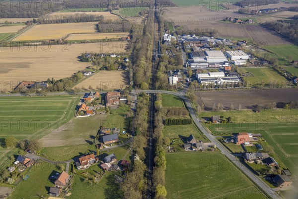 Aerial view, railway station Capelle (Westf), commercial area Magdheide, wooded railway line and bridge Bahnhofstraße, Gasthof Zur Brücke, Capelle, Nordkirchen, Münsterland, North Rhine-Westphalia, Germany, railway area, railway station, platform, DE, Deutsche Bahn AG, Europe, commercial enterprises, commercial area, commercial area, commercial property, commercial location, commercial use, railway tracks, tracks, industrial area, industrial location, aerial view, aerial photography, aerial photography, road bridge, overview, bird's-eye view, birds-eyes view, overview