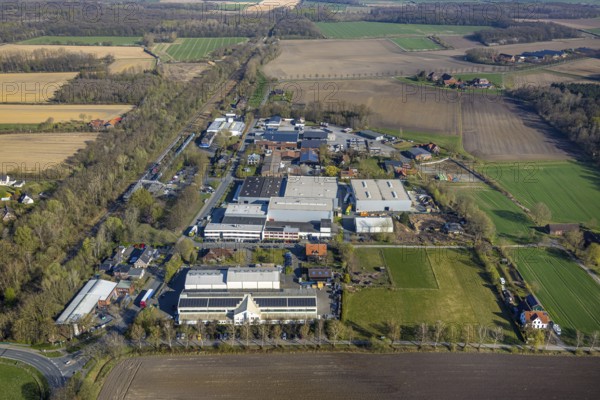 Aerial view, railway station Capelle (Westf), industrial area Magdheide, forested railway line, Capelle, Nordkirchen, Münsterland, North Rhine-Westphalia, Germany, railway area, railway station, platform, DE, Deutsche Bahn AG, Europe, commercial enterprises, commercial area, commercial property, commercial site, commercial use, railway tracks, tracks, industrial area, industrial site, aerial photograph, aerial photography, aerial photography, road bridge, overview, bird's eye view, birds-eyes view, overview