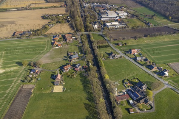 Aerial view, railway station Capelle (Westf), commercial area Magdheide, wooded railway line and bridge Bahnhofstraße, Gasthof Zur Brücke, Capelle, Nordkirchen, Münsterland, North Rhine-Westphalia, Germany, railway area, railway station, platform, DE, Deutsche Bahn AG, Europe, commercial enterprises, commercial area, commercial area, commercial property, commercial location, commercial use, railway tracks, tracks, industrial area, industrial location, aerial view, aerial photography, aerial photography, road bridge, overview, bird's-eye view, birds-eyes view, overview