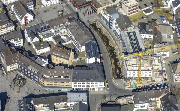 Aerial view, construction site with construction crane at Winziger Platz corner Zeughausstraße and river Henne Promenade, Meschede-Stadt, Meschede, Sauerland, North Rhine-Westphalia, Germany, construction work, construction area, building site, building plots, construction project, construction site, DE, Europe, aerial view, aerial photography, aerial photography, new building, overview, bird's-eye view, bird's-eye view, overview