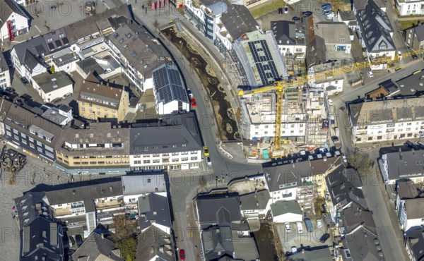 Aerial view, construction site with construction crane at Winziger Platz corner Zeughausstraße and river Henne Promenade, Meschede-Stadt, Meschede, Sauerland, North Rhine-Westphalia, Germany, construction work, construction area, building site, building plots, construction project, construction site, DE, Europe, aerial view, aerial photography, aerial photography, new building, overview, bird's-eye view, bird's-eye view, overview