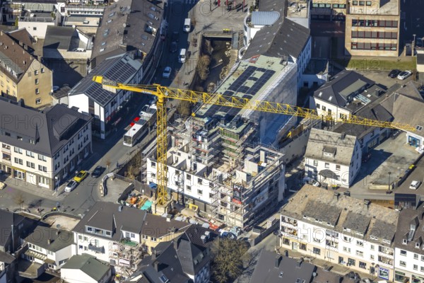 Aerial view, construction site with construction crane at Winziger Platz corner Zeughausstraße and river Henne Promenade, Meschede-Stadt, Meschede, Sauerland, North Rhine-Westphalia, Germany, construction work, construction area, building site, building plots, construction project, construction site, DE, Europe, aerial view, aerial photography, aerial photography, new building, overview, bird's-eye view, bird's-eye view, overview