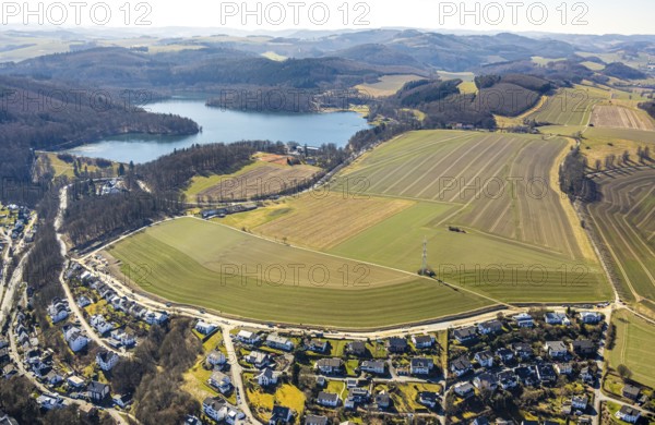Aerial view, Hennesee dam with wooded area and hilly landscape, meadows and fields with residential area, Meschede town, Meschede, Sauerland, North Rhine-Westphalia, Germany, DE, Europe, property tax, Hennetalsperre, real estate, aerial view, aerial photography, aerial photography, overview, bird's-eye view, residential area, living and living, residential area, quality of living, residential neighbourhood, housing estate, residential area, birds-eyes view, overview
