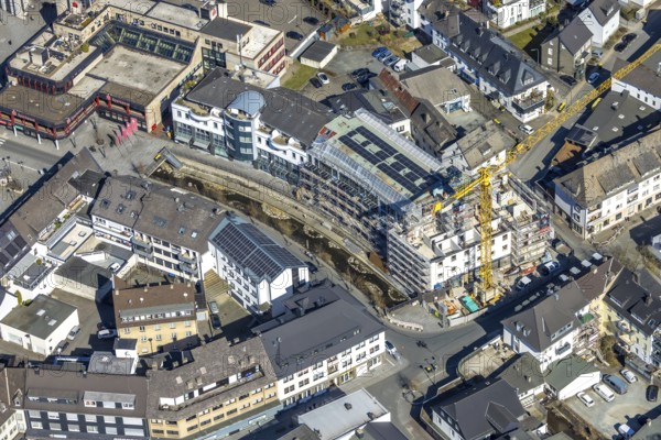 Aerial view, construction site with construction crane at Winziger Platz corner Zeughausstraße and river Henne Promenade, Meschede-Stadt, Meschede, Sauerland, North Rhine-Westphalia, Germany, construction work, construction area, building site, building plots, construction project, construction site, DE, Europe, aerial view, aerial photography, aerial photography, new building, overview, bird's-eye view, bird's-eye view, overview
