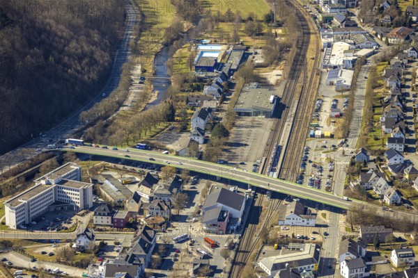 Aerial view, road bridge Warsteiner Straße federal road B55 over railway tracks and commercial area Le-Puy-Straße, left building of the employment agency and river Ruhr, Meschede town, Meschede, Sauerland, North Rhine-Westphalia, Germany, DE, Europe, commercial enterprises, commercial area, commercial property, commercial location, commercial use, industrial area, industrial location, job centre, aerial view, aerial photography, aerial photography, overview, bird's eye view, birds-eyes view, overview