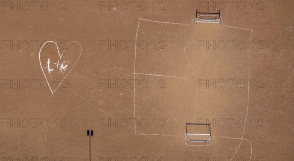 Aerial view, sports field cinder pitch Schulzentrum an der Realschule, heart symbol L+M drawn on the field, Meschede-Stadt, Meschede, Sauerland, North Rhine-Westphalia, Germany, DE, Europe, aerial view, aerial photography, aerial photography, overview, bird's eye view, birds-eyes view, overview