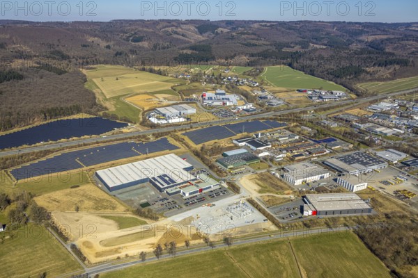 Aerial view, commercial area Enste with citizen solar park at the motorway A46, Enste, Meschede, Sauerland, North Rhine-Westphalia, Germany, DE, Europe, photovoltaic, commercial enterprises, commercial area, commercial property, commercial site, commercial use, industrial area, industrial site, aerial view, aerial photography, aerial photography, photovoltaic plant, solar, solar plant, solar roof, solar energy, solar panel, solar park, solar power plant, overview, bird's-eye view, birds-eyes view, overview