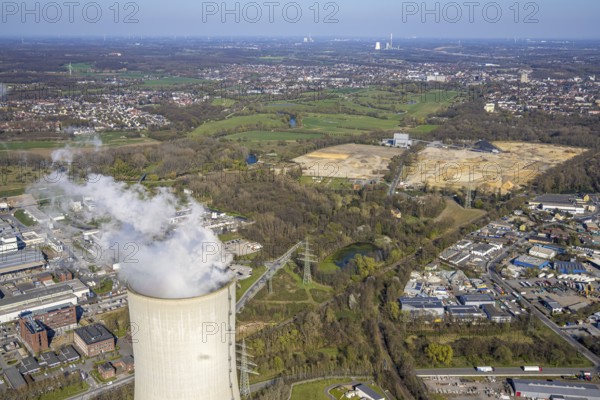 Aerial view, Trianel Kohlekraftwerk Lünen GmbH with smoking cooling tower, behind brownfield former STEAG power plant site, Lippholthausen, Lünen, Ruhr area, North Rhine-Westphalia, Germany, DE, Europe, commercial enterprises, commercial area, commercial property, commercial site, commercial use, industrial area, industrial site, power plant, cooling tower, aerial view, aerial photography, aerial photography, Münsterland, smoke, overview, bird's eye view, bird's eye view, overview