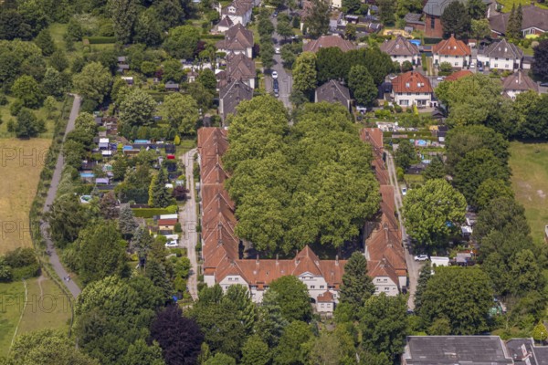 Aerial view, housing estate settlement Teutoburgia miners' settlement with group of trees in the inner courtyard, also garden city Teutoburgia, Börnig, Herne, Ruhr area, North Rhine-Westphalia, Germany, workers' houses, workers' settlement, tree avenue, tree growth, miners' settlement, mining settlement, DE, monument protection, Europe, green trees, aerial view, aerial photography, aerial photography, housing estate, overview, bird's-eye view, housing estate, colliery houses, colliery housing estate, birds-eyes view, green planting, green lung, overview, social housing, HernerechtsderA43