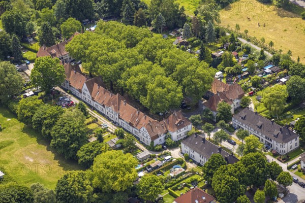 Aerial view, housing estate settlement Teutoburgia miners' settlement with group of trees in the inner courtyard, also garden city Teutoburgia, Börnig, Herne, Ruhr area, North Rhine-Westphalia, Germany, workers' houses, workers' settlement, tree avenue, tree growth, miners' settlement, mining settlement, DE, monument protection, Europe, green trees, aerial view, aerial photography, aerial photography, housing estate, overview, bird's-eye view, housing estate, colliery houses, colliery housing estate, birds-eyes view, green planting, green lung, overview, social housing, HernerechtsderA43