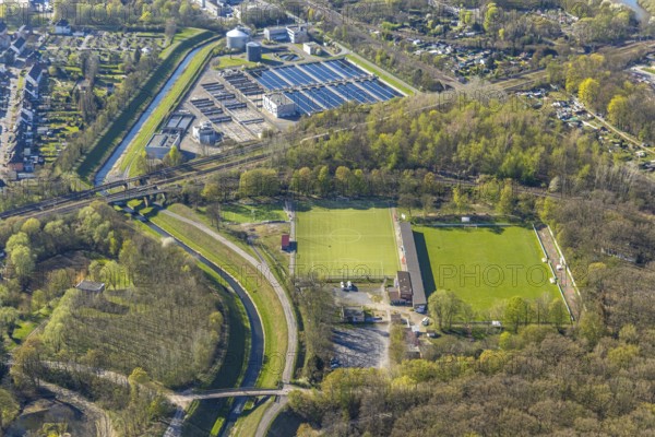 Aerial view, sports facility football stadium Kampfbahn Schwansbell of Lüner SV, sewage treatment plant and river Seseke, Horstmar, Lünen, Ruhr area, North Rhine-Westphalia, Germany, DE, Europe, football pitch, football stadium, aerial view, aerial photography, aerial photography, Münsterland, sport, sports facilities, sports field, sports facility, stadium, overview, bird's-eye view, bird's-eye view, overview