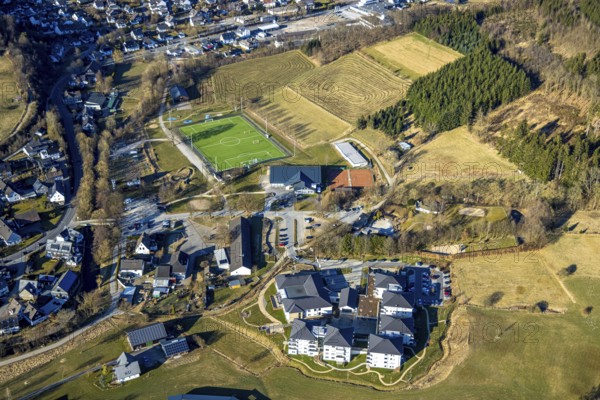 Aerial view, TRACTO-Sportpark Saalhausen football stadium, construction site, below WohnGut Saalhausen Seniorenzentrum, Saalhausen, Lennestadt, Sauerland, North Rhine-Westphalia, Germany, retirement home, old people's home, care and nursing, DE, Europe, football pitch, football stadium, aerial view, aerial photography, aerial photography, care facility, retirement home, retirement residence, retirement home, retirement centre, sports, sports facilities, sports field, stadium, overview, bird's eye view, bird's eye view, overview